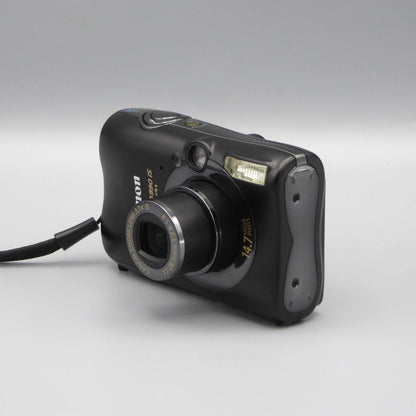Front and side view of a black Canon PowerShot SD990 IS with its lens extended