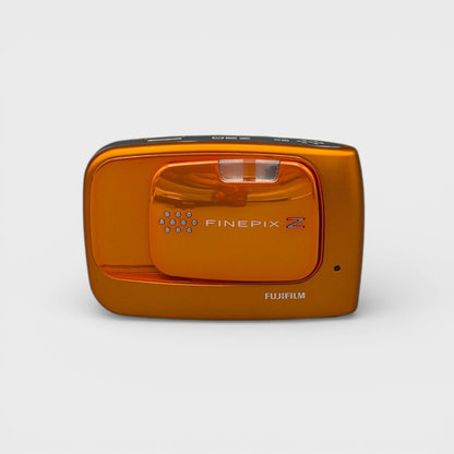Orange Fujifilm FinePix Z30 front view with its sliding lens cover closed.