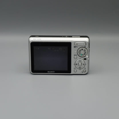 Rear view of a silver Sony Cyber-shot DSC-S750 showing its LCD screen, mode dial and circular control pad