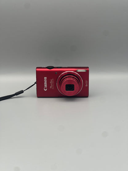 Front view of a red Canon PowerShot ELPH 130 IS with its lens extended