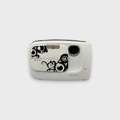 White Fujifilm FinePix Z30 with a black swirl pattern, viewed from the front with its lens exposed.