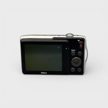 Rear view of a silver Nikon Coolpix S3300 showing the LCD screen and control buttons