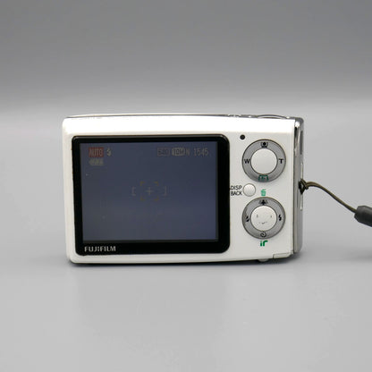 Rear view of a white Fujifilm FinePix Z20fd showing its LCD screen and two circular controls