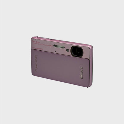 Front and side view of a pink Sony Cyber-shot DSC-TX5 showing the exposed lens