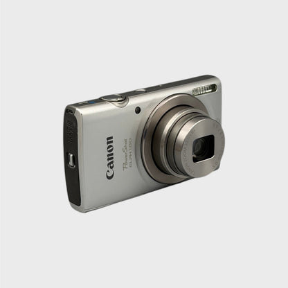 Silver Canon PowerShot ELPH 180 viewed from a front angle with the lens extended.