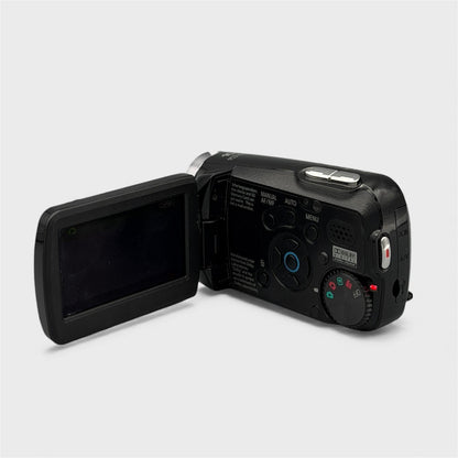 Panasonic SDR-S7P camcorder with its screen open, showing the menu buttons and mode dial