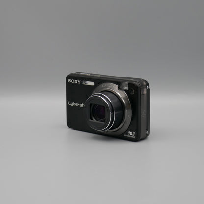 Black Sony Cyber-shot DSC-W170 viewed from the opposite front corner with its lens extended