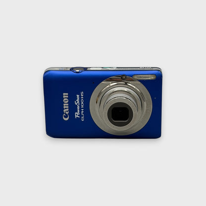 Blue Canon PowerShot ELPH 100 HS front view with its silver lens extended.