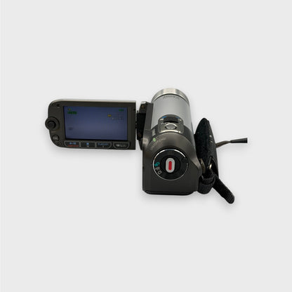 Rear view of the silver Canon FS200 camcorder with its LCD screen open and hand strap visible