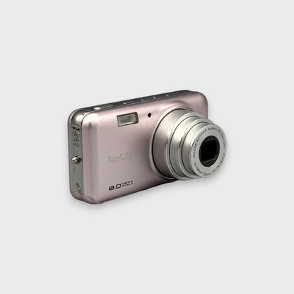 Angled front view of a pink Kodak EasyShare V803 showing the extended lens and top controls