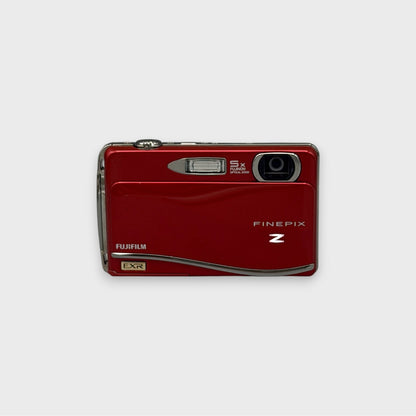 Front view of a red Fujifilm FinePix Z800EXR showing the exposed lens and flash
