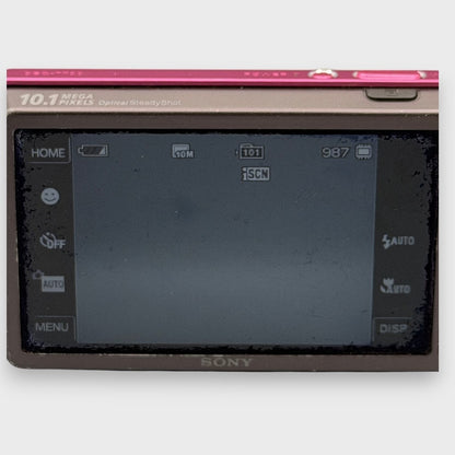 Close-up of the rear LCD screen on a pink Sony Cyber-shot DSC-T700 showing shooting controls and screen edges