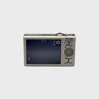 Rear view of a silver Canon PowerShot SD790 IS showing the illuminated LCD screen and control buttons
