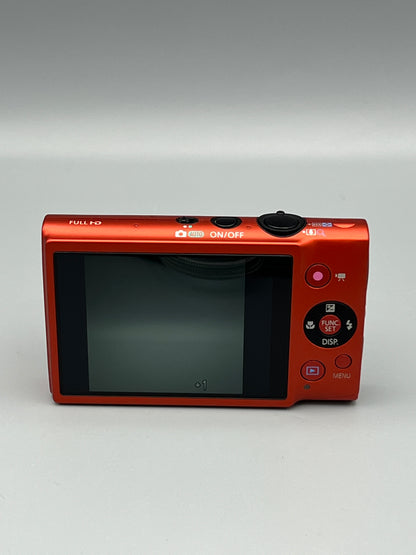 Rear view of a red Canon PowerShot ELPH 110 HS showing its LCD screen and circular control pad