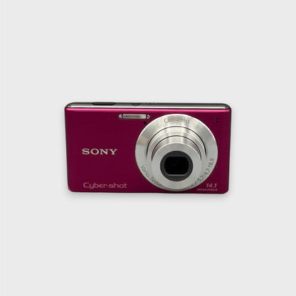 Pink Sony Cyber-shot DSC-W530 front view with its silver lens extended.