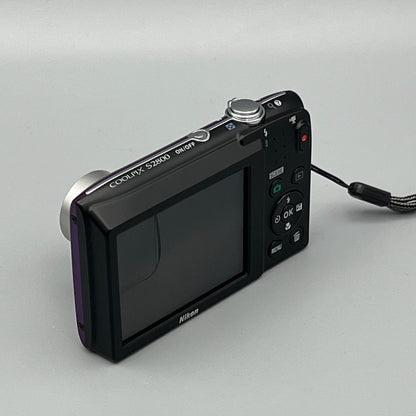 Nikon Coolpix S2800 viewed from above at a rear angle showing the LCD screen and top controls.