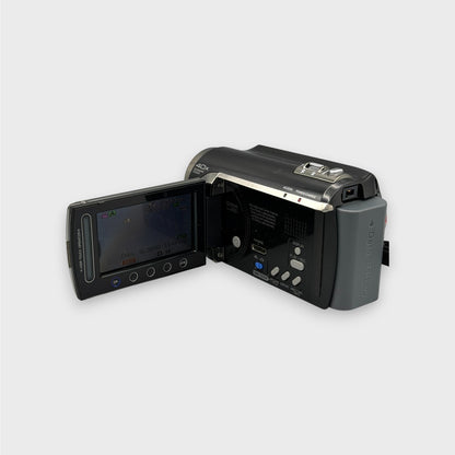 Rear view of the JVC Everio GZ-MG680 camcorder with its LCD display lit and side controls visible