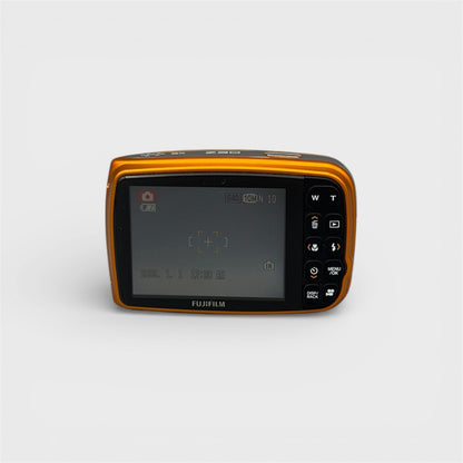Orange Fujifilm FinePix Z30 rear view showing the LCD screen and control buttons.