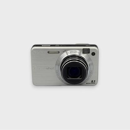 Silver Sony Cyber-shot DSC-W150 front view with its lens extended.