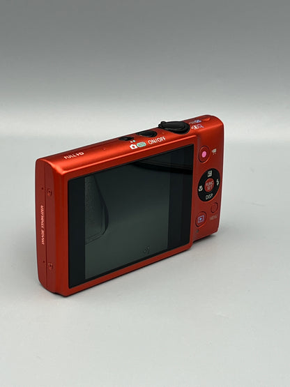 Angled rear view of a red Canon PowerShot ELPH 110 HS showing its LCD screen and control buttons