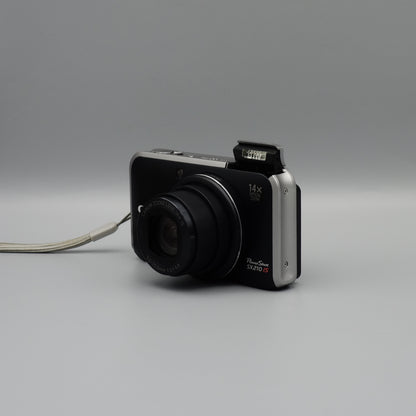Front and side view of a black Canon PowerShot SX210 IS with its lens extended and flash raised