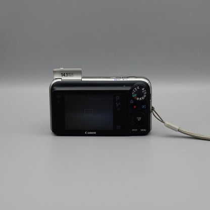 Rear view of a black Canon PowerShot SX210 IS showing the LCD screen and control buttons