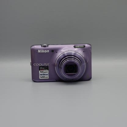 Purple Nikon Coolpix S6400 front view with its lens extended.