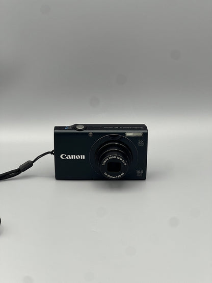 Front view of a black Canon PowerShot A3400 IS digital camera with its lens extended