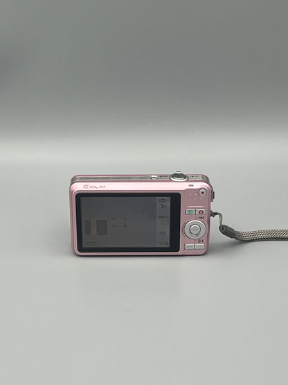 Pink Casio Exilim EX-Z85 rear view showing the LCD screen and control buttons.