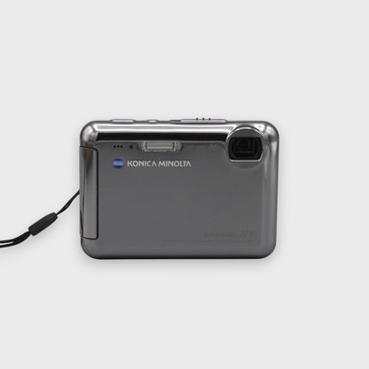 Gray Konica Minolta DiMAGE X1 front view showing its corner lens and flash.