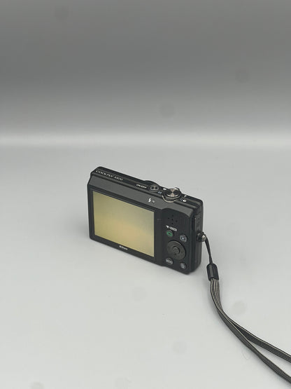 Nikon Coolpix S570 viewed from a rear angle showing the LCD screen, buttons and wrist strap.