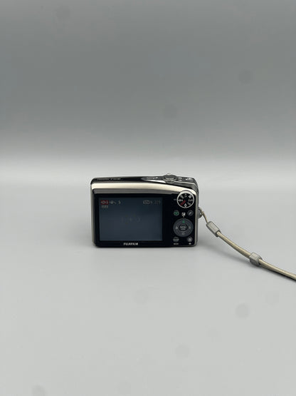 Fujifilm FinePix F50FD rear view showing the LCD screen and control buttons.