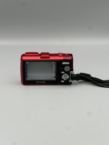 Rear view of a red Olympus Stylus Tough TG-830 showing the LCD screen and control buttons