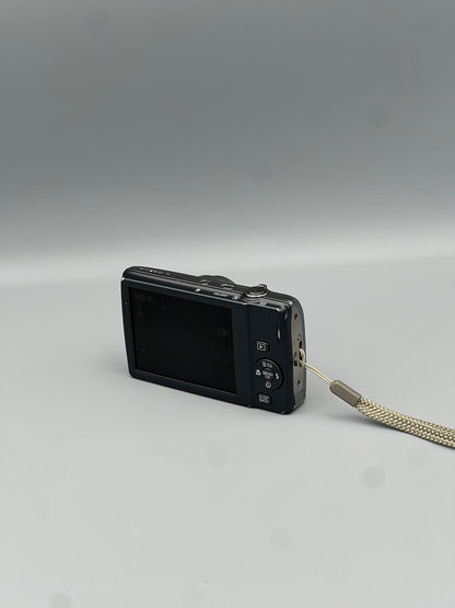 Angled rear view of a silver Fujifilm FinePix T550 showing the LCD screen and control panel