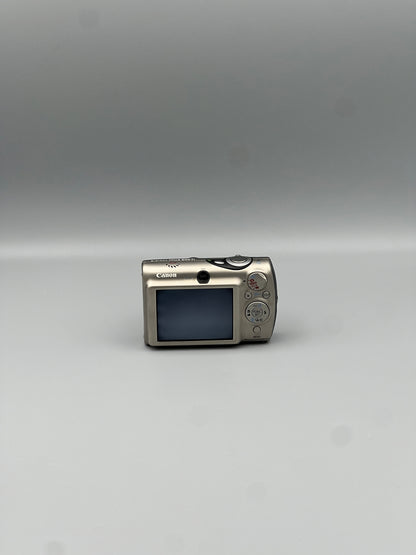 Rear view of a silver Canon PowerShot SD900 showing its LCD screen, viewfinder and circular control pad