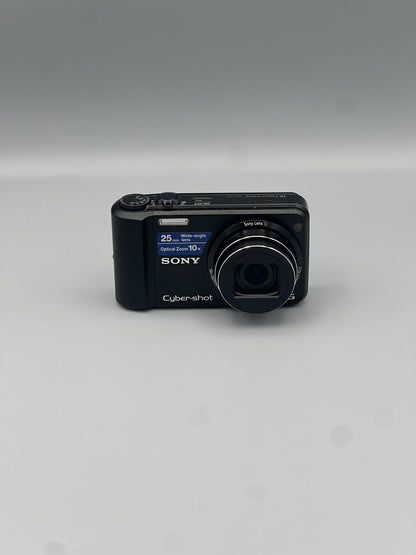 Front view of a black Sony Cyber-shot DSC-H70 digital camera with its lens extended