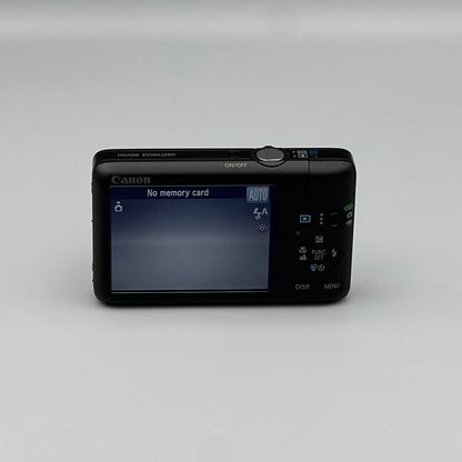 Canon PowerShot SD940 IS rear view showing the LCD screen and control buttons.