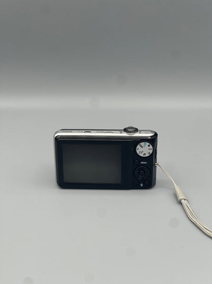 Rear view of a black Samsung TL205 showing the LCD screen and control buttons