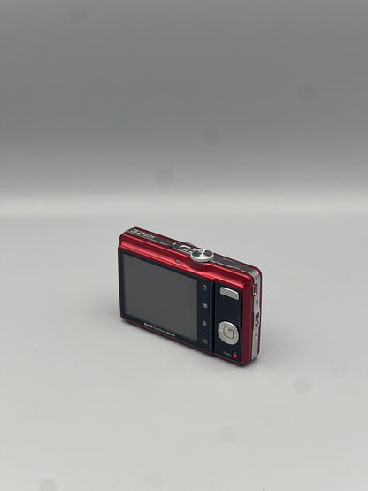 Red Kodak EasyShare M340 viewed from a rear angle showing the LCD screen and control buttons.