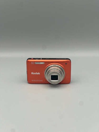 Front view of an orange Kodak EasyShare M5350 digital camera with its lens extended
