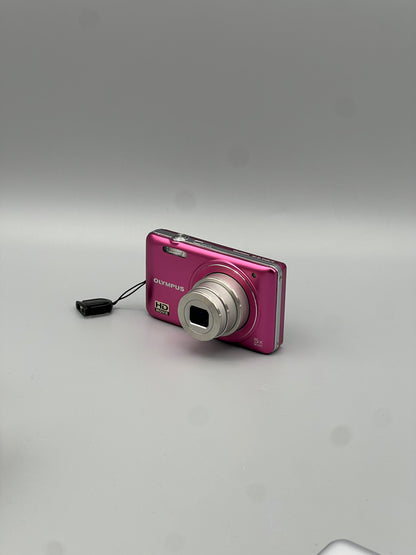 Front and side view of a pink Olympus VG-130 with its lens extended