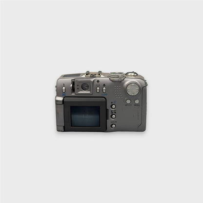 Canon PowerShot G2 rear view showing the LCD screen, viewfinder, control dial and buttons.