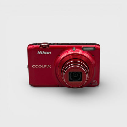 Red Nikon Coolpix S6500 front view with its lens extended.