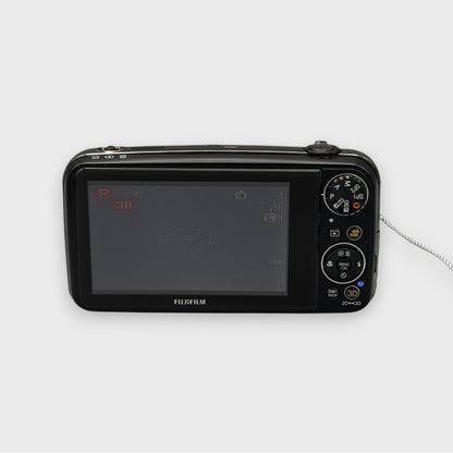 Rear view of a black Fujifilm FinePix REAL 3D W3 showing its LCD screen, mode dial and circular control pad