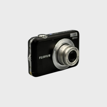 Angled front view of a black Fujifilm FinePix JV100 showing its extended silver lens and rounded side panel