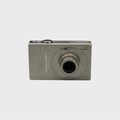 Front view of a silver Canon PowerShot SD790 IS digital camera with its lens extended