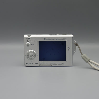 Rear view of a silver Sony Cyber-shot DSC-T7 showing the illuminated LCD screen and control buttons