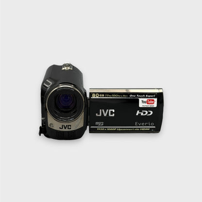Front view of the black and silver JVC Everio GZ-MG680 camcorder with its lens and flip-out screen open