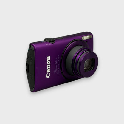Angled front view of a purple Canon PowerShot ELPH 310 HS showing the extended lens and top controls