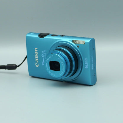 Front and side view of a blue Canon PowerShot ELPH 110 HS with its lens extended